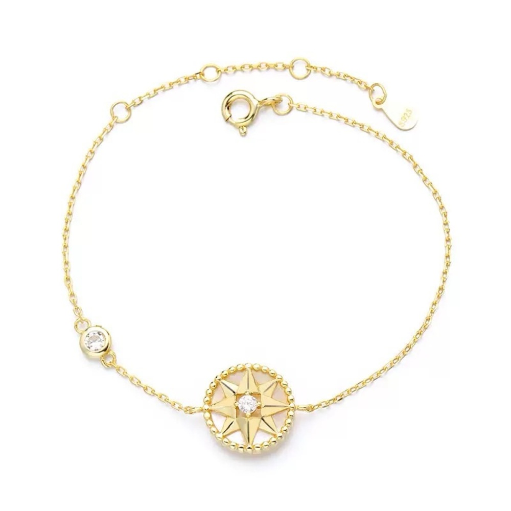 Elegant Gold Starburst Bracelet with Crystal Accent